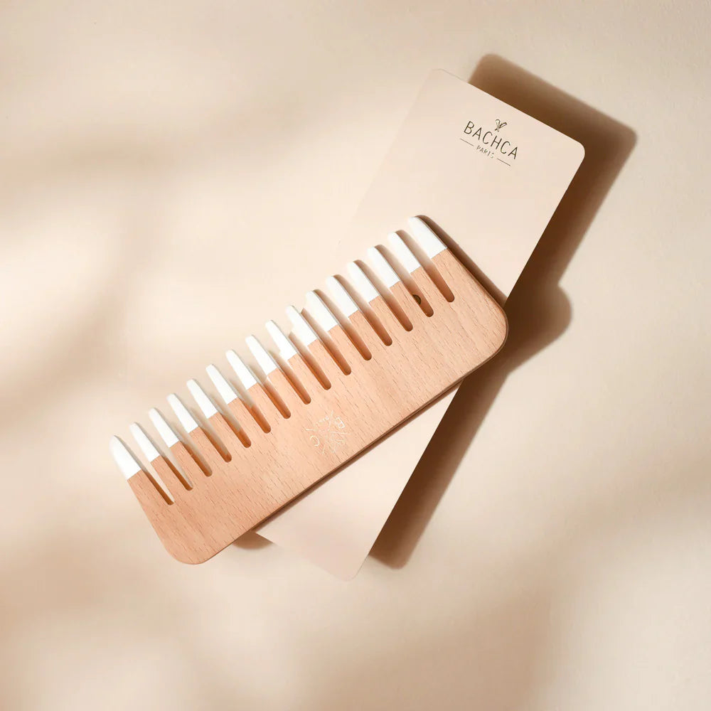 Bachca wooden comb with light wood handle and evenly spaced teeth