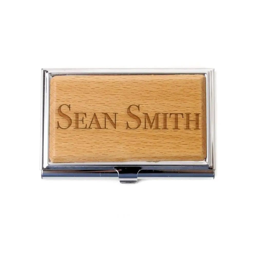 Bamboo business card holder with laser-engraved name "SEAN SMITH"