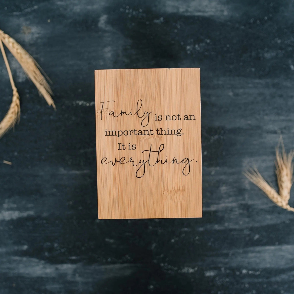 Bamboo utensil holder with quote text reading 'Everything'