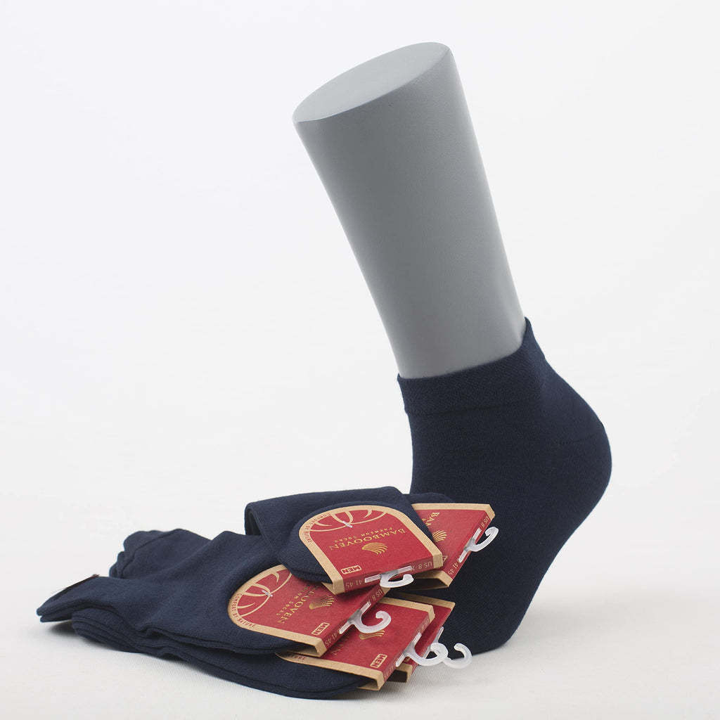 Navy ankle socks with red packaging tags, folded and stacked