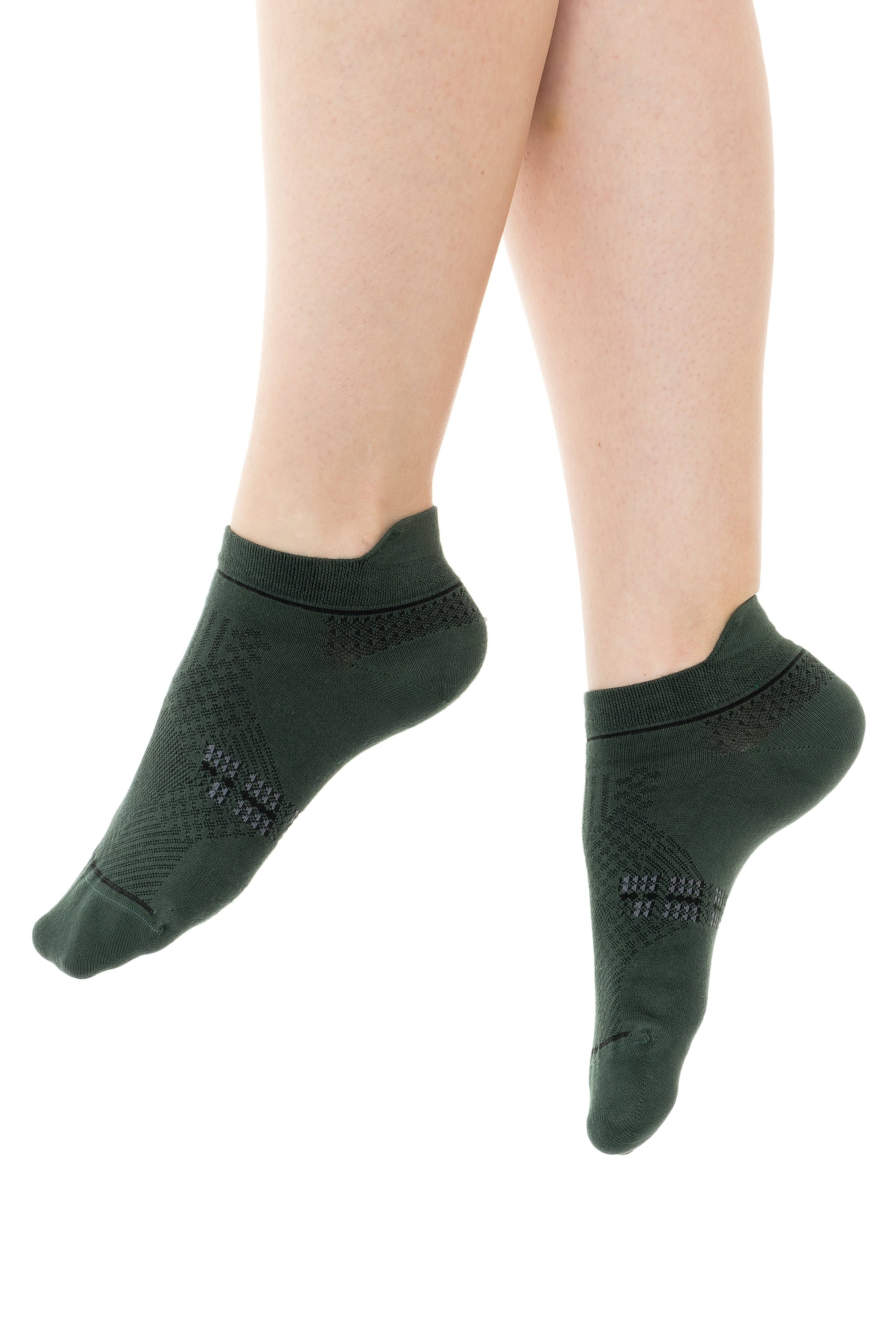 Green ankle socks on legs, ribbed cuff with small logo near toe