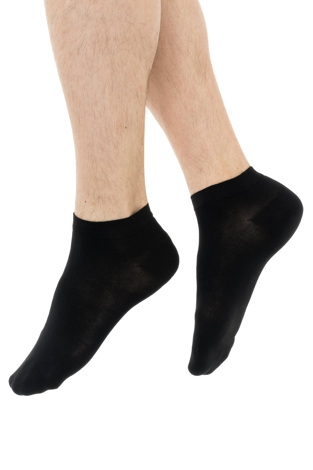 Black ankle socks on feet, close view of legs and socks
