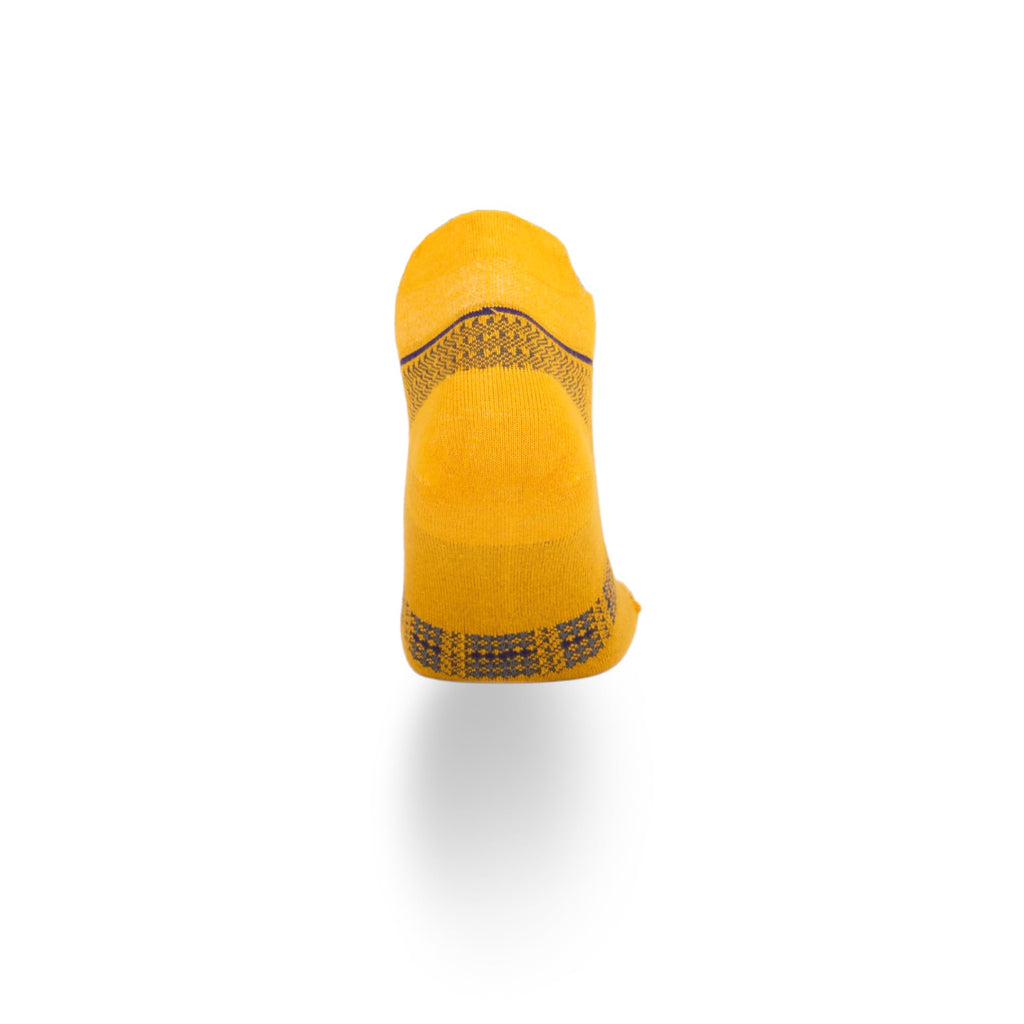Yellow ankle socks with dark geometric knit band across the back and toe