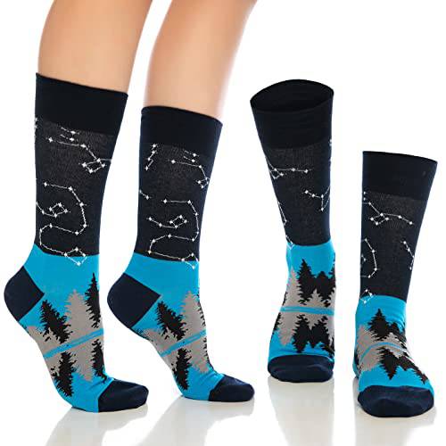 Crew socks with black bases, blue tree silhouettes, and dotted geometric line patterns.