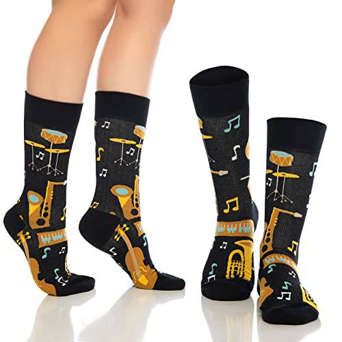 Crew socks with black bases, musical note and instrument prints, and gold/orange details.
