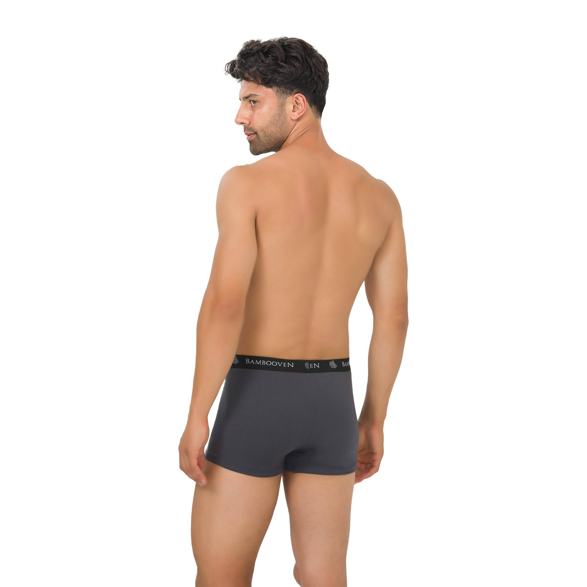 Men's bamboo boxer trunks with logo waistband, dark gray on model, back view