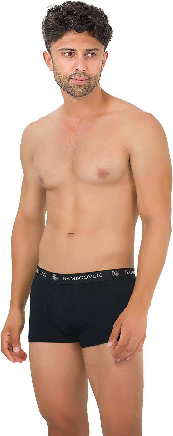 Men's bamboo boxer trunks with logo waistband, black on model, front view