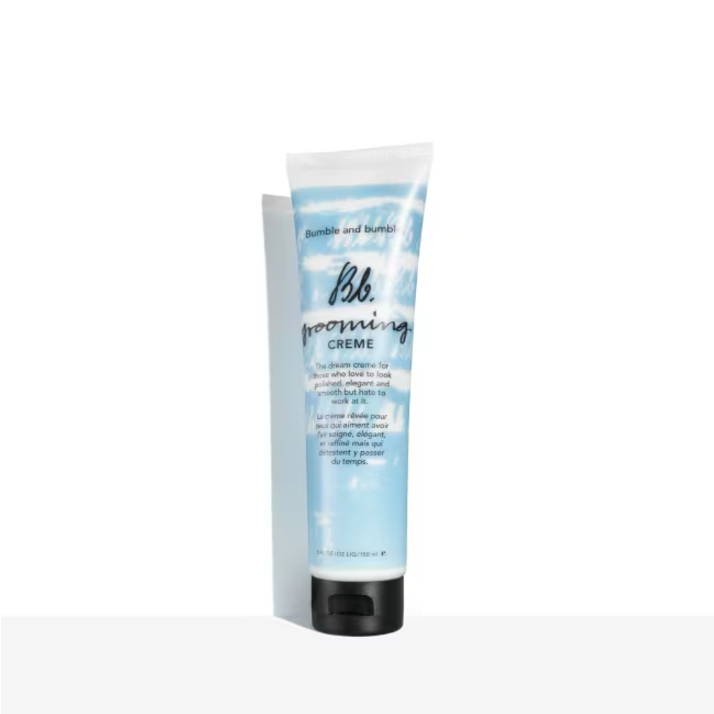 Hair grooming creme in a blue-and-white squeeze tube with black cap, 5 oz
