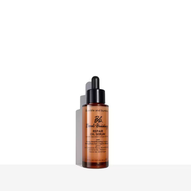 Bumble and Bumble Bond-Building Repair Oil Serum bottle with black dropper, amber liquid.