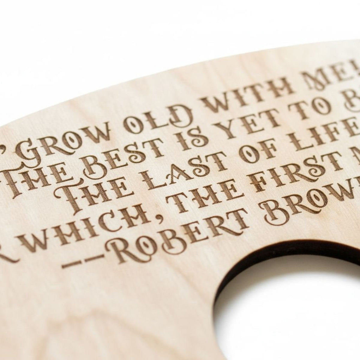 Close-up engraved wood wine holder text: “Grow old with me” and name Robert