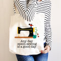 Cream canvas sewing tote bag with sewing machine graphic and “Any day spent sewing” text