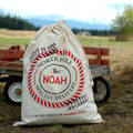 Canvas Santa sack with red 'North Pole' stamp, 'To: Noah', drawstring top.