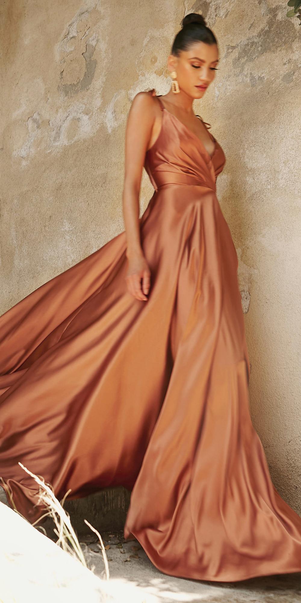 Satin A-line gown with draped V-neck bodice, sleeveless design, long skirt with leg slit, copper