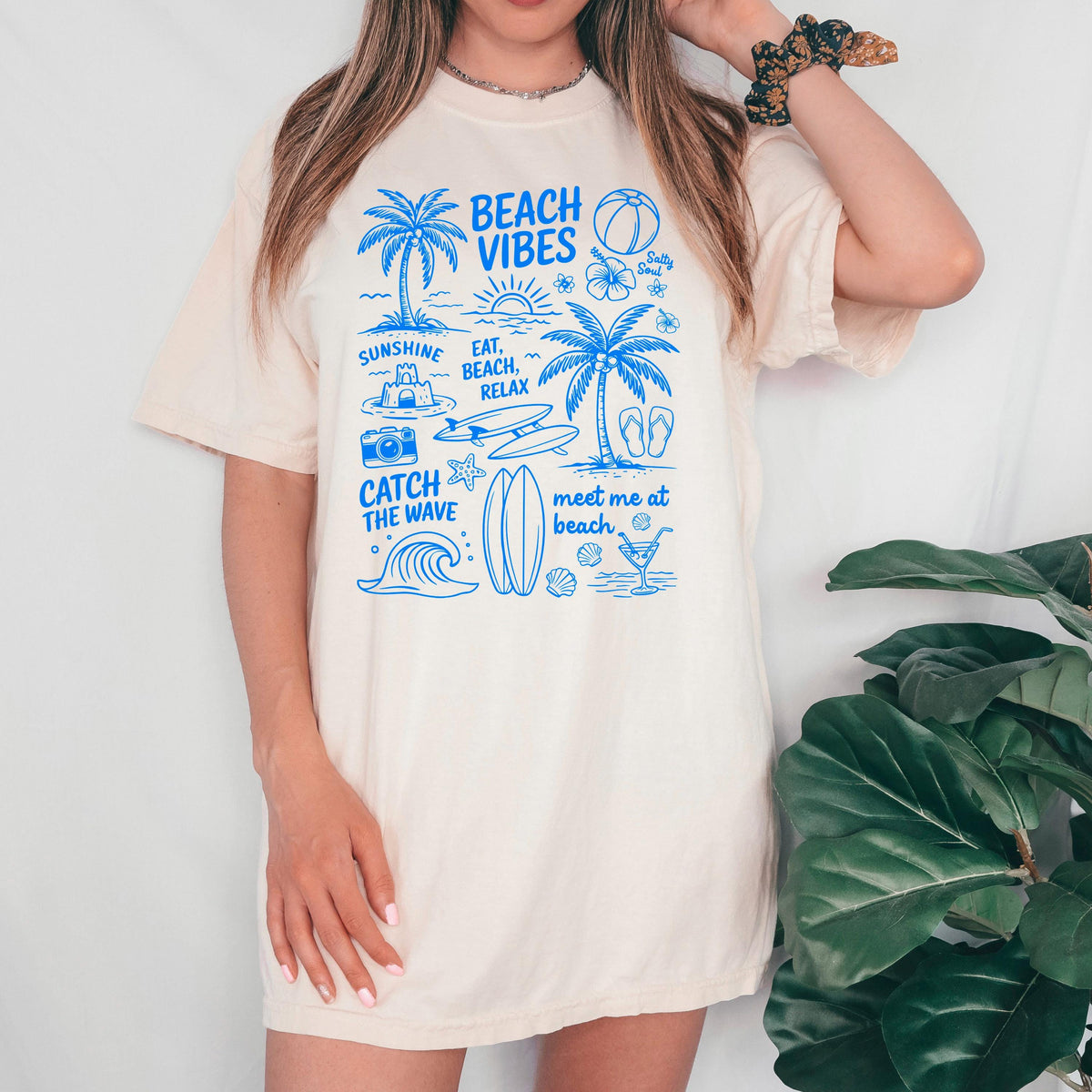 Ivory women’s T-shirt dress with blue “Beach Vibes” front graphic print