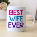 White coffee mug with 'BEST WIFE EVER' lettering in purple, blue, and pink