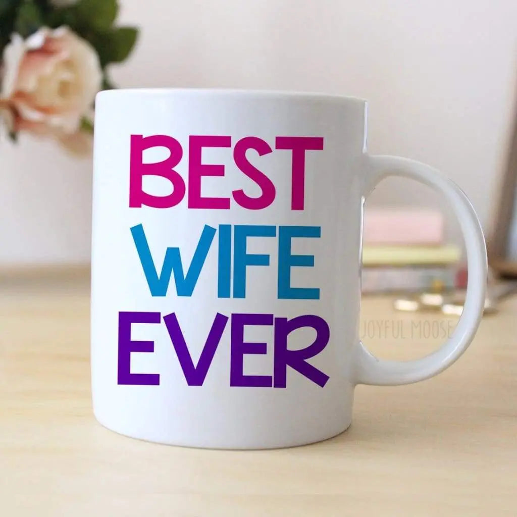 White coffee mug with 'BEST WIFE EVER' lettering in purple, blue, and pink