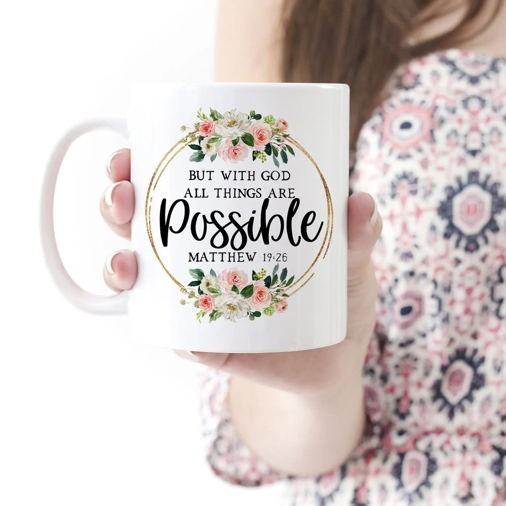 White ceramic coffee mug with floral wreath 'All things are possible' (Matthew 19:26)