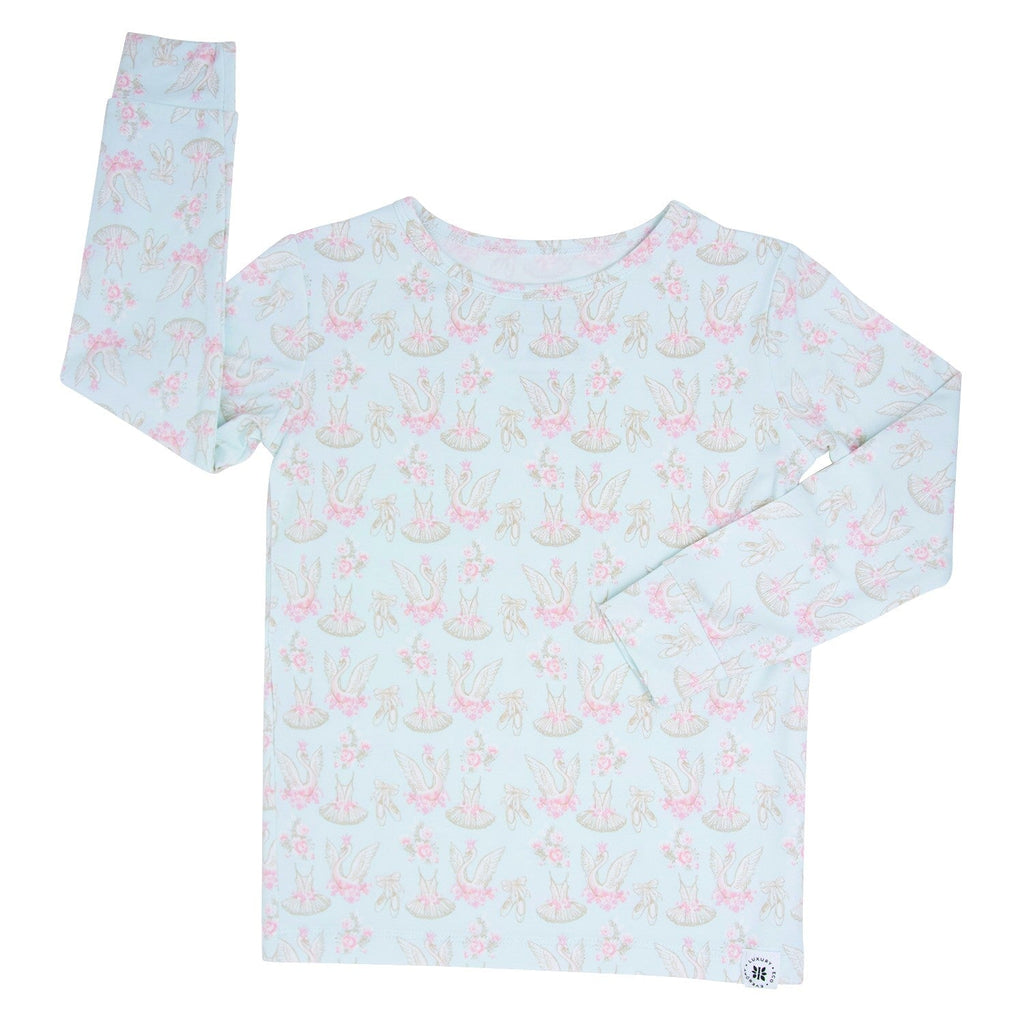 Long-sleeve girls' pajama top in light blue with pastel swan pattern