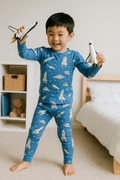 Boys blue space-themed pajama set with rocket print, long sleeves and ankle pants