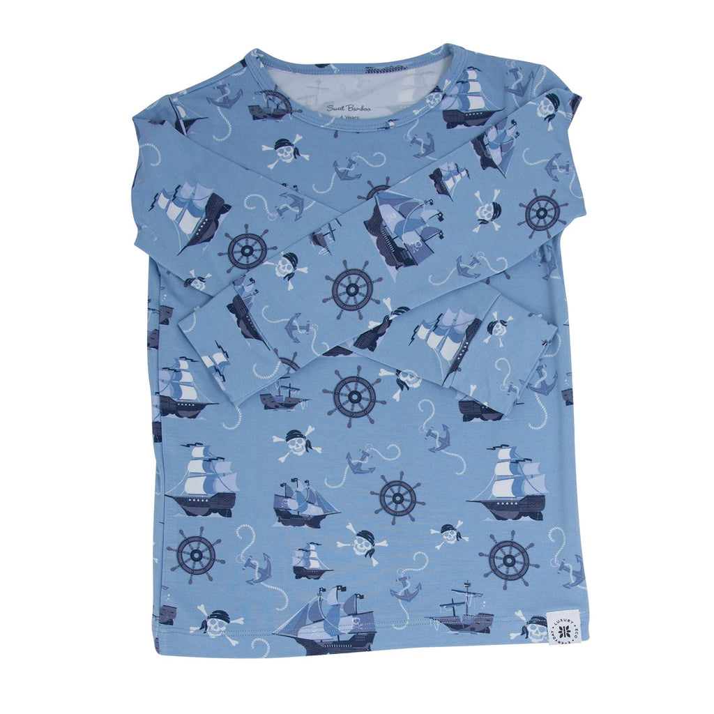 Blue long-sleeve kids pajama shirt with pirate ships, anchors, and wheel pattern