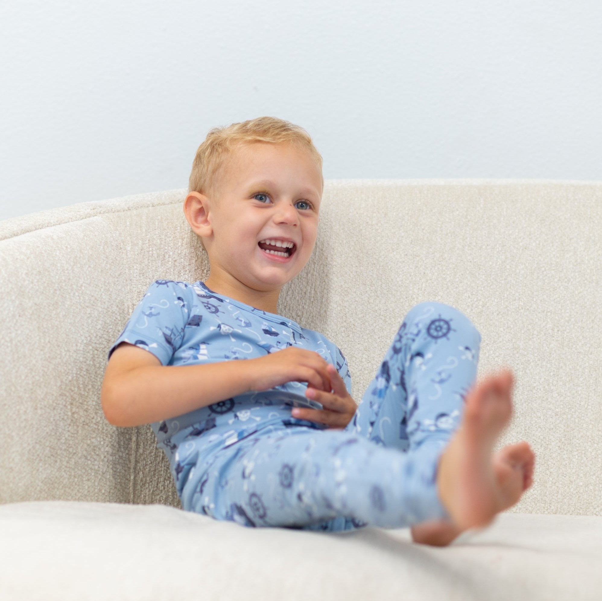 Light blue pirate-themed short-sleeve pajama top with nautical symbols
