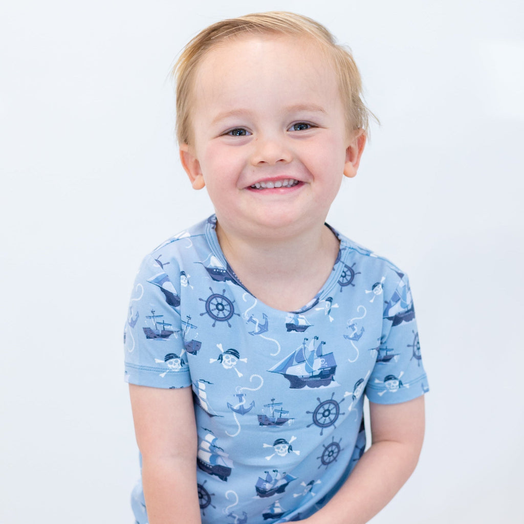 Light blue pirate-themed short-sleeve pajama top with ship and anchor print