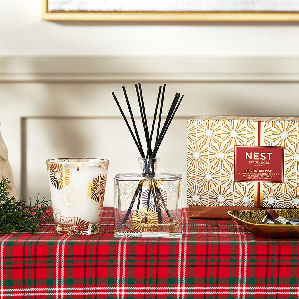 Reed diffuser with black reeds and scented candle, with birchwood pine branded packaging