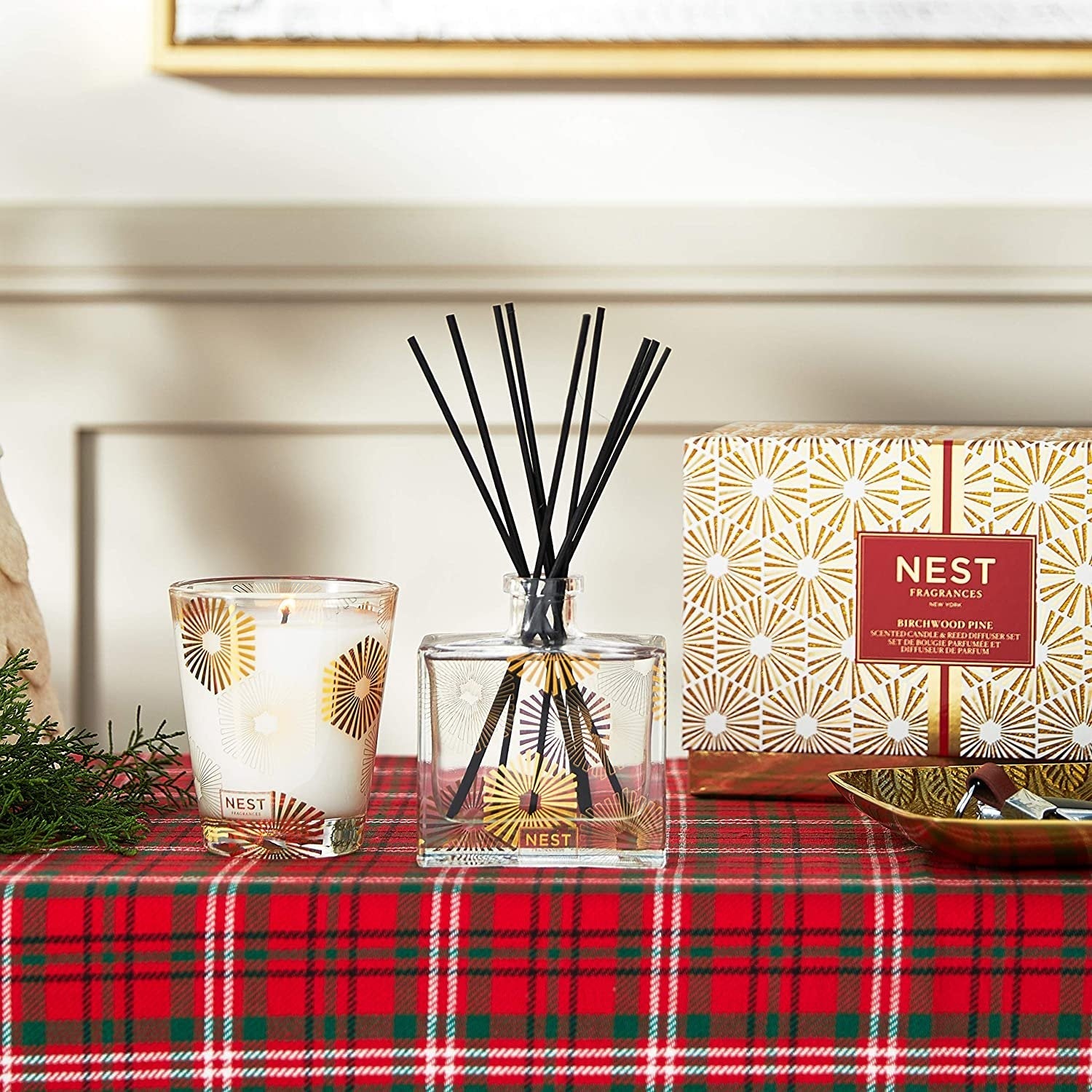 Reed diffuser with black reeds and scented candle, with birchwood pine branded packaging