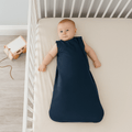 Navy blue infant sleep sack, sleeveless with angled zipper seam