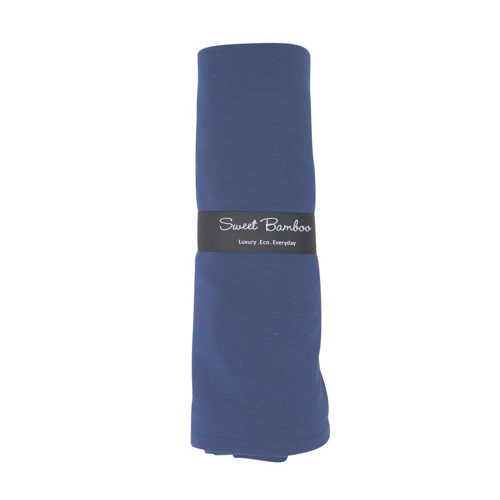Blue swaddle blanket roll with Sweet Bamboo label on folded fabric
