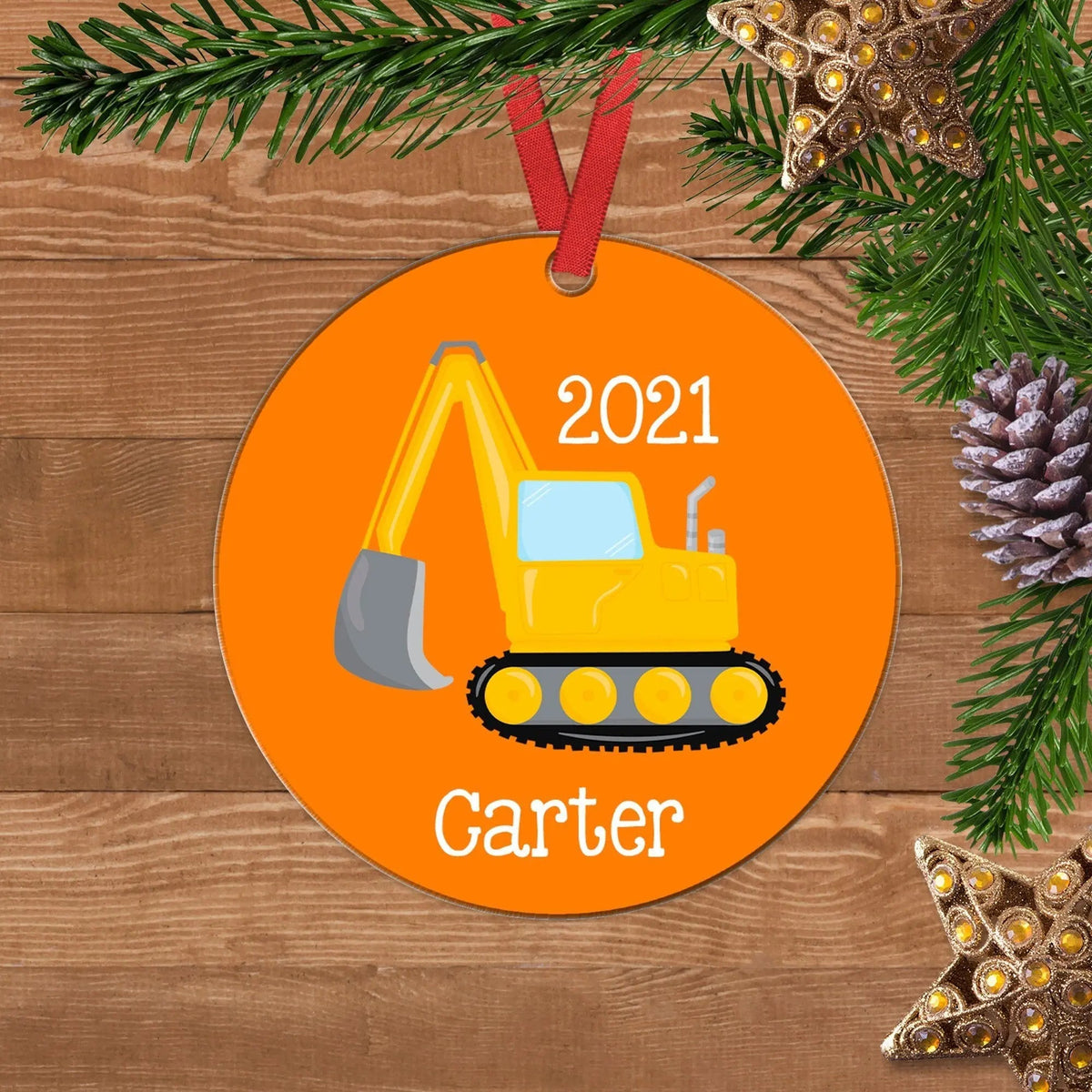 Personalized backhoe Christmas ornament, orange round with Carter name and 2021