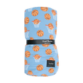 Big kid cloud blanket with orange basketballs and white hoops on blue