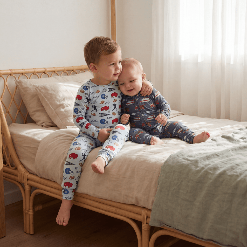 Boys convertible romper in navy with red and white vehicle print, long sleeves and feet