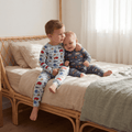 Boys convertible romper in navy with red and white vehicle print, long sleeves and feet