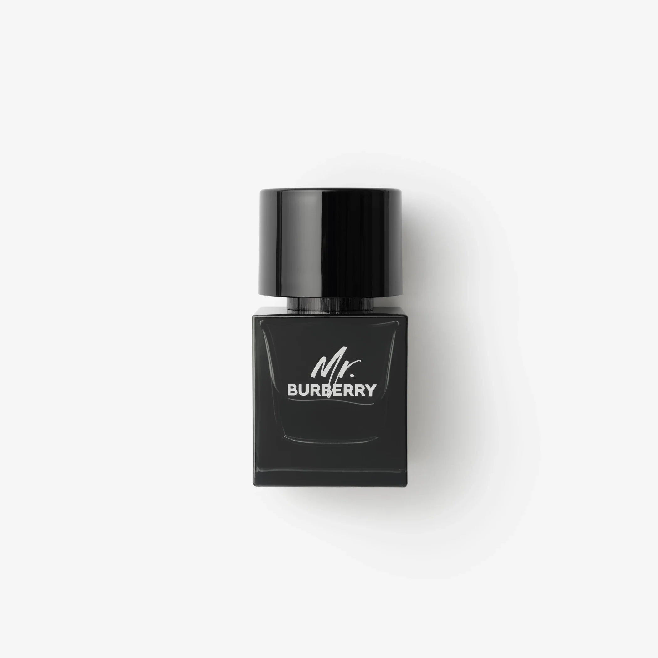 Eau de parfum bottle, black glass with silver cap and Mr. Burberry label