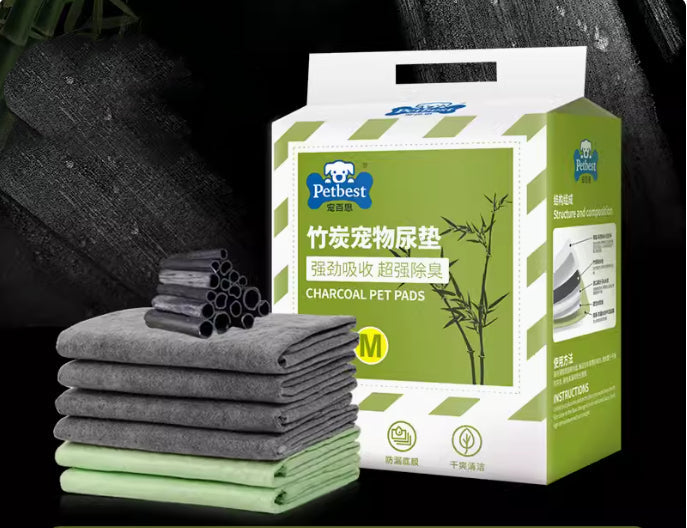 Charcoal and green pet pads stack with M-size product box packaging