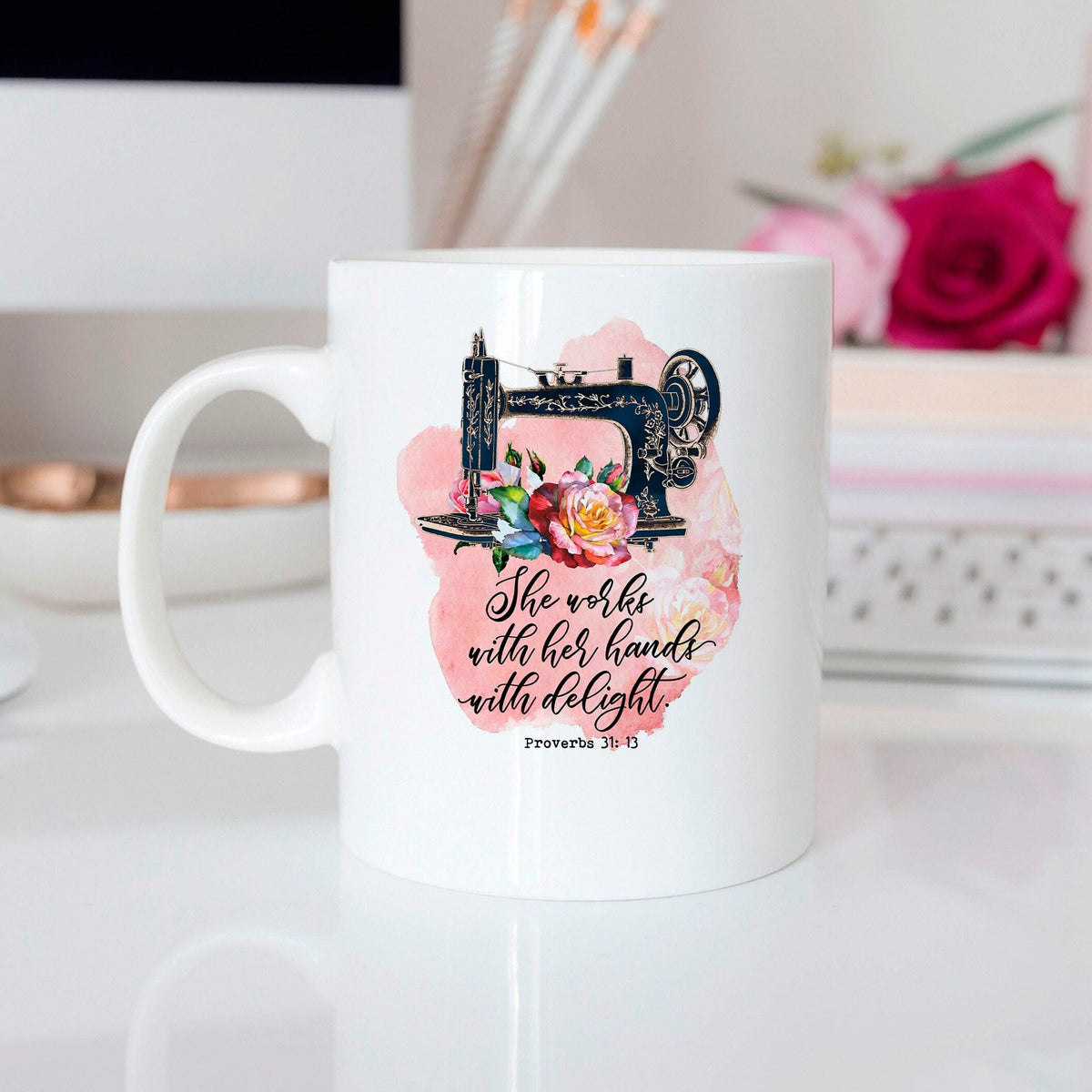 Proverbs 31 coffee mug close-up, white with watercolor flowers and sewing machine artwork