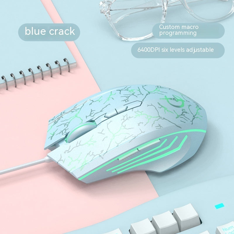 Wired esports gaming mouse in light blue with green crack pattern and green light bars.