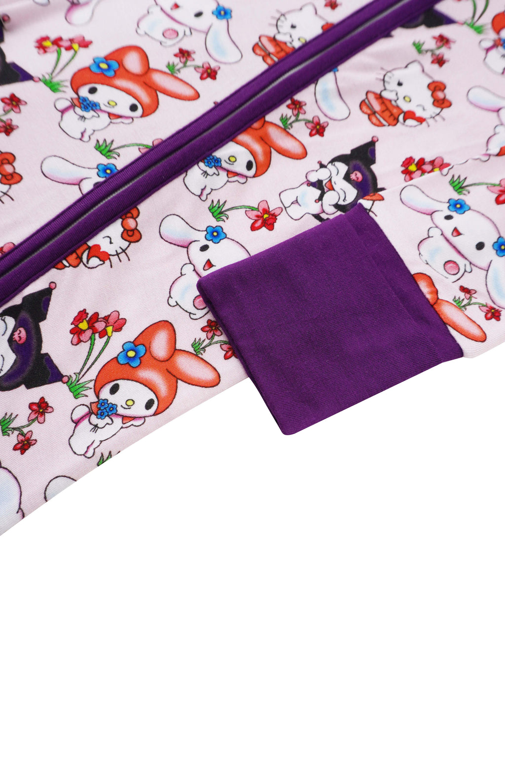 Baby romper flat lay with purple inner cuff and matching character print