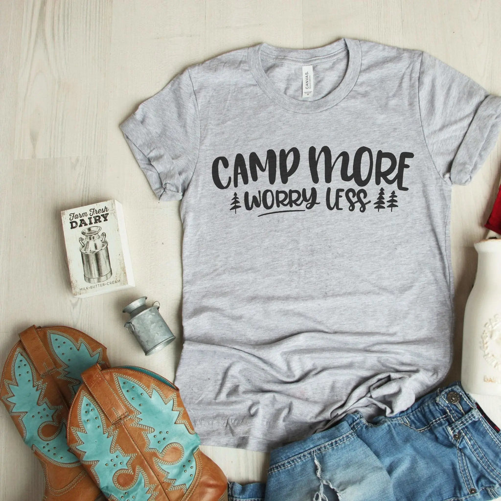 Light gray T-shirt with 'CAMP MORE WORRY LESS' camping graphic and pine tree print