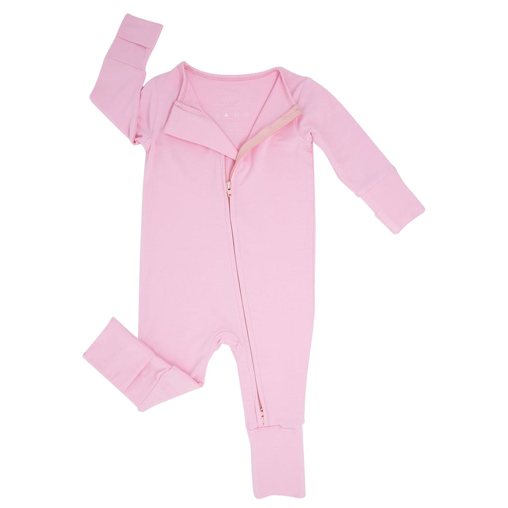 Pink footed sleeper romper for girls with front zipper and fold-over cuffs