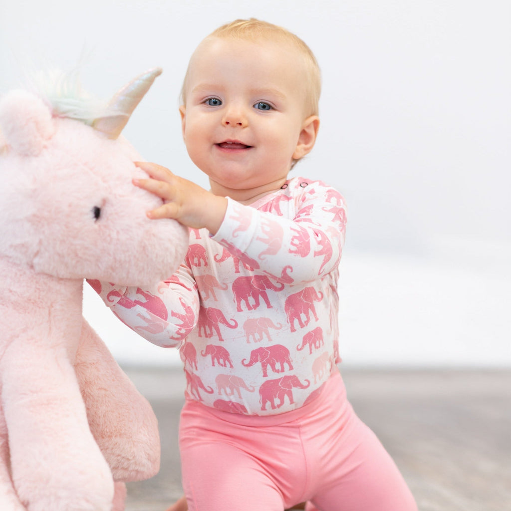 Girl’s candy pink flare leggings side view, elastic waistband and wide bell-bottom legs