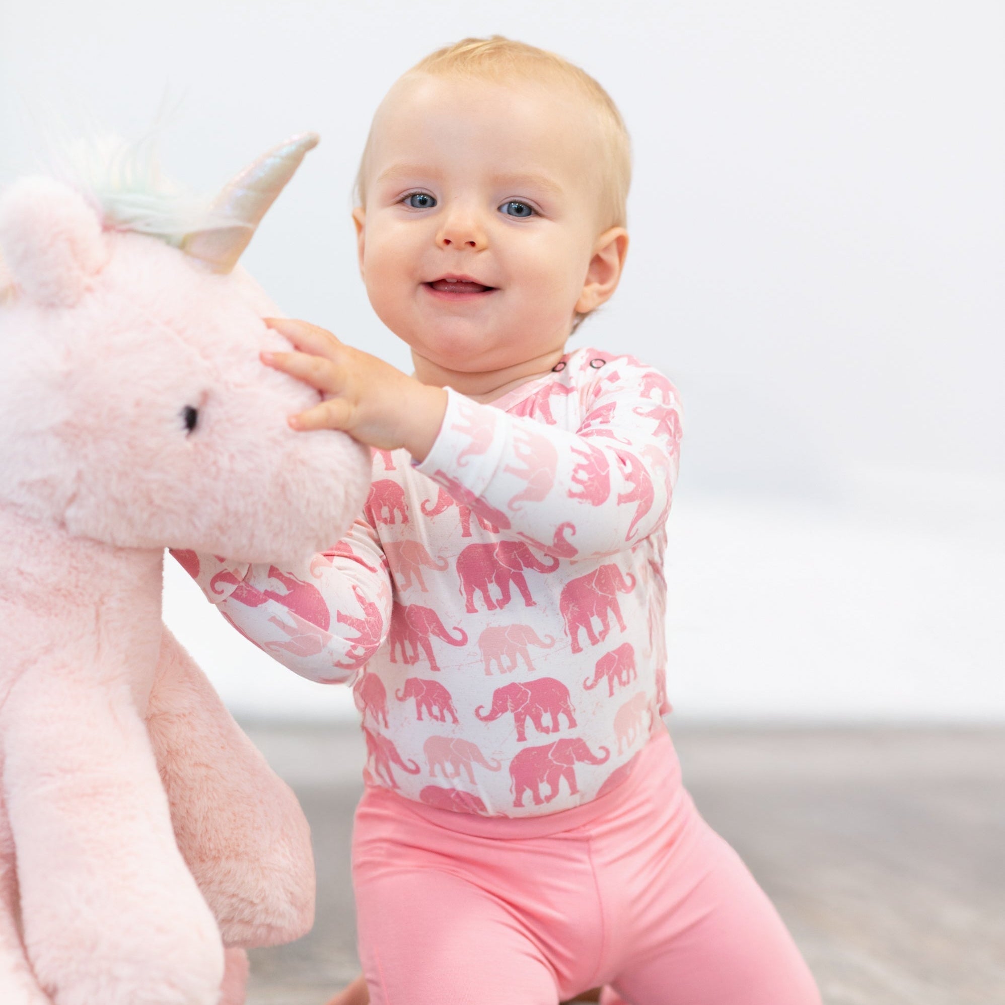 Girl’s candy pink flare leggings side view, elastic waistband and wide bell-bottom legs