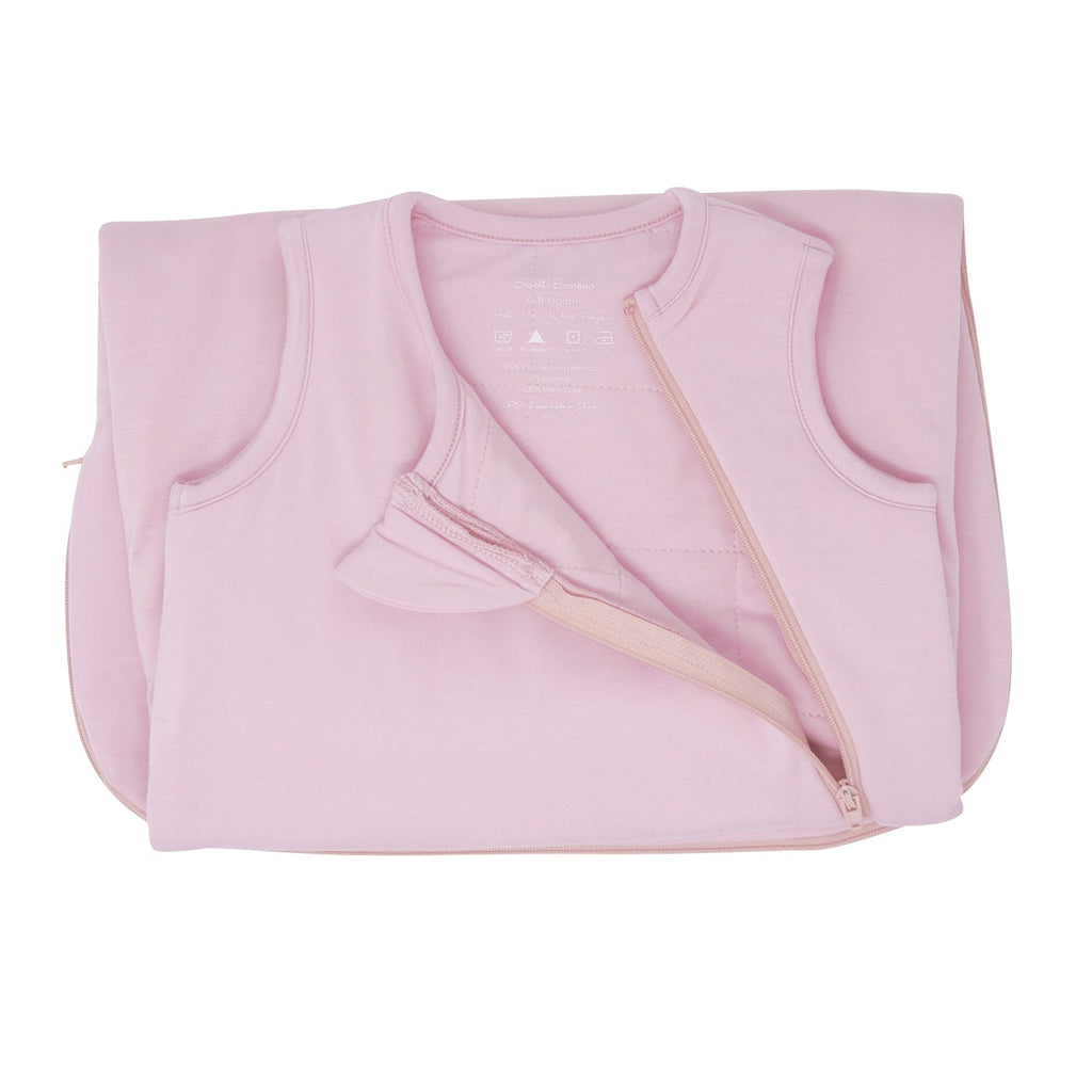 Candy pink baby sleep sack folded, showing front zipper and shoulder opening