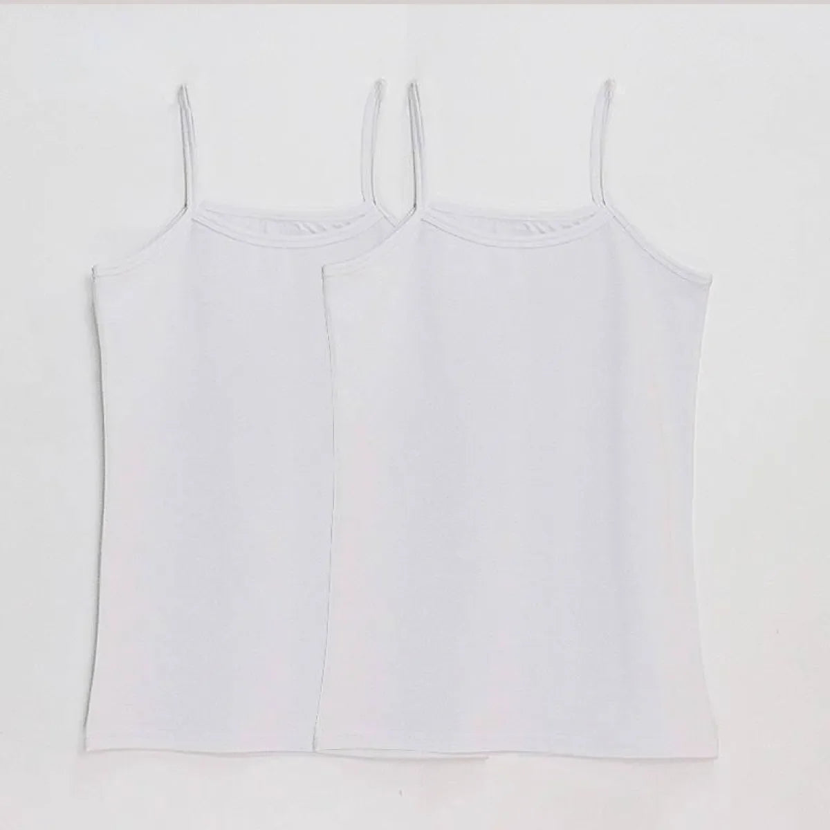 Pair of white spaghetti-strap camisole tops with scoop neck and straight hem.