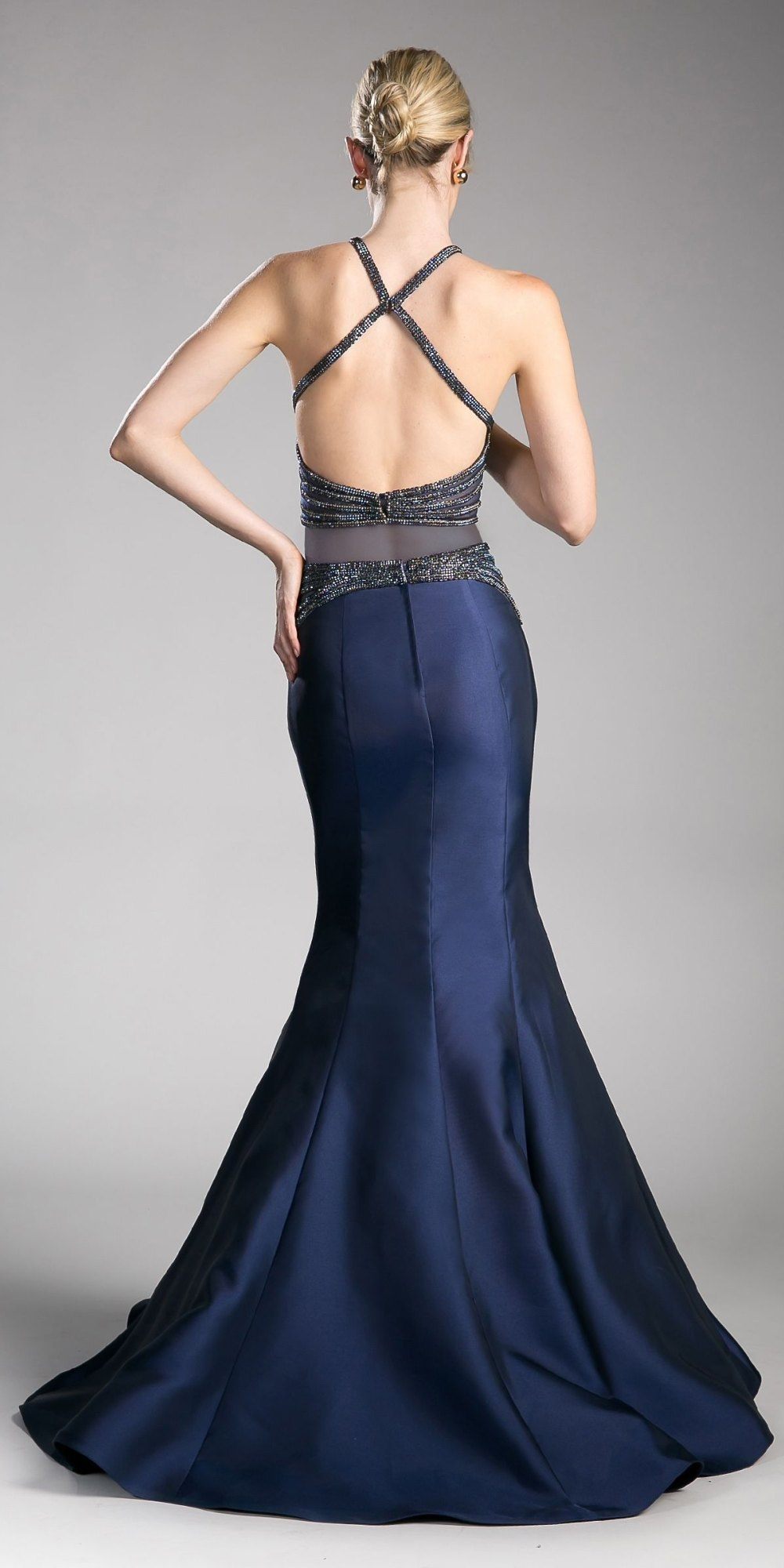 Navy two-piece mermaid gown with open-back halter crop top and long fitted skirt