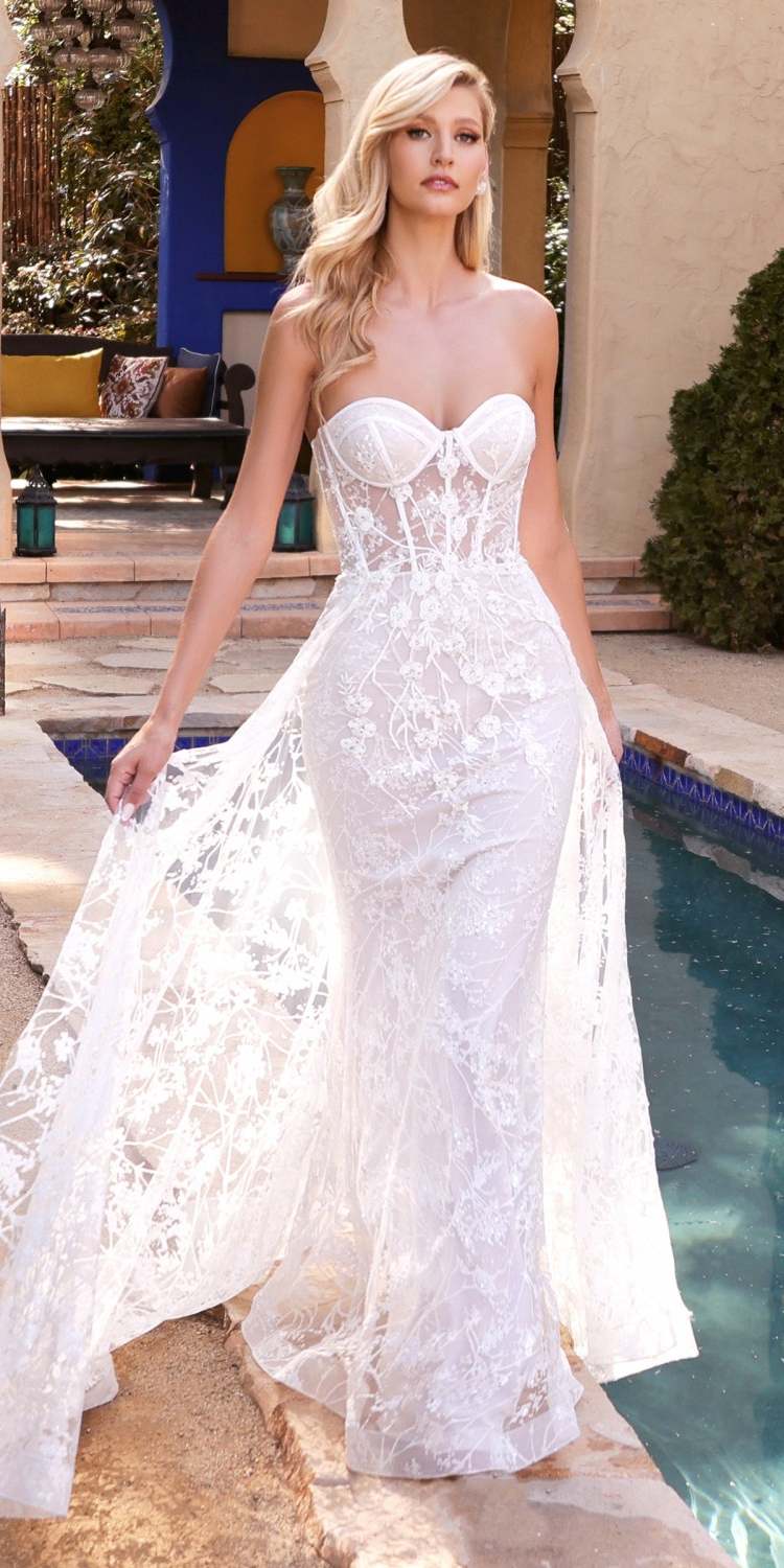 Off-white strapless lace gown with floral applique and glittery tulle overskirt
