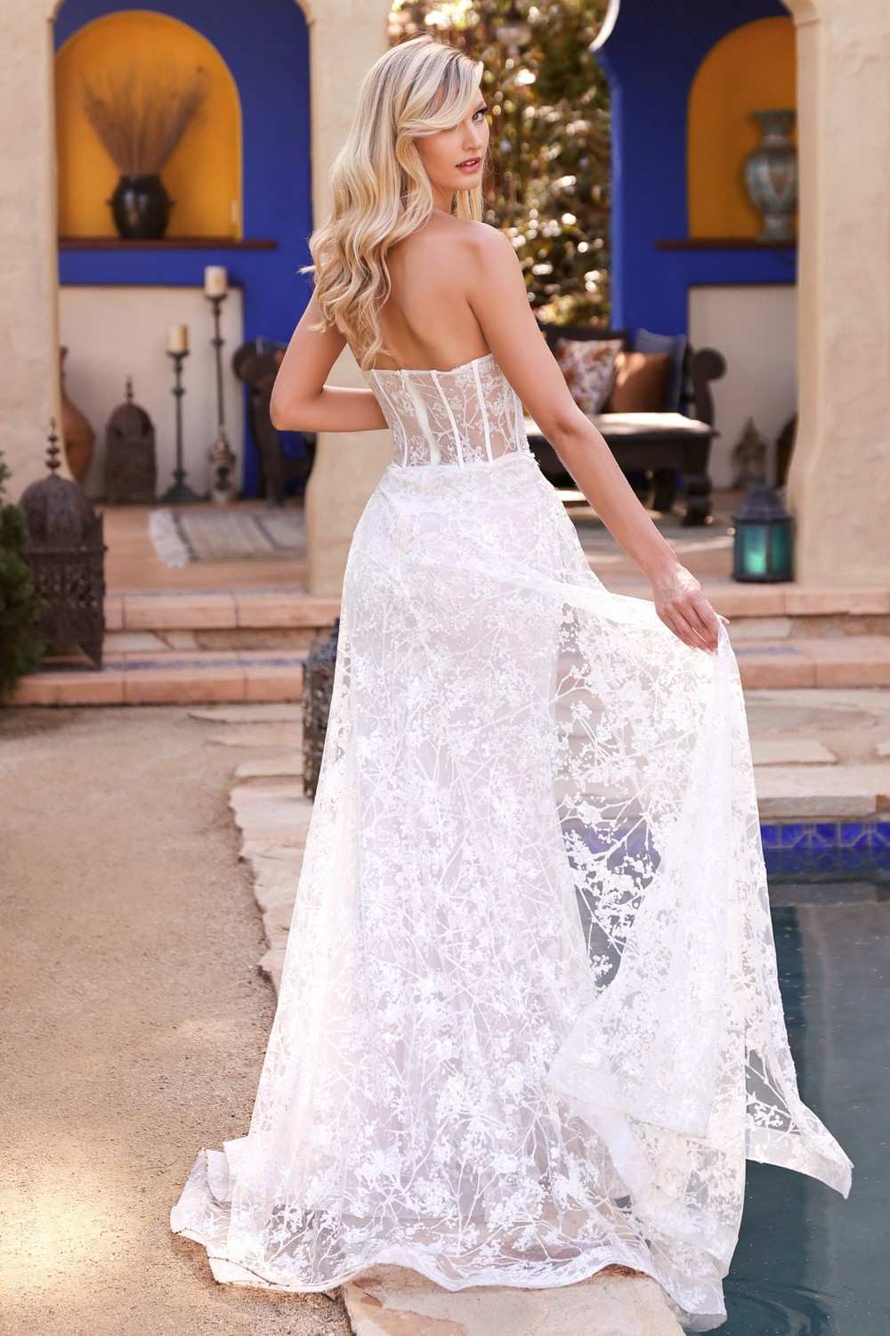 Off-white strapless lace gown with floral applique and flared tulle train