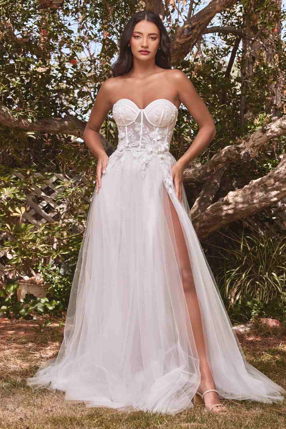 Off-white strapless tulle ball gown, corset-style bodice with floral details, full-length skirt