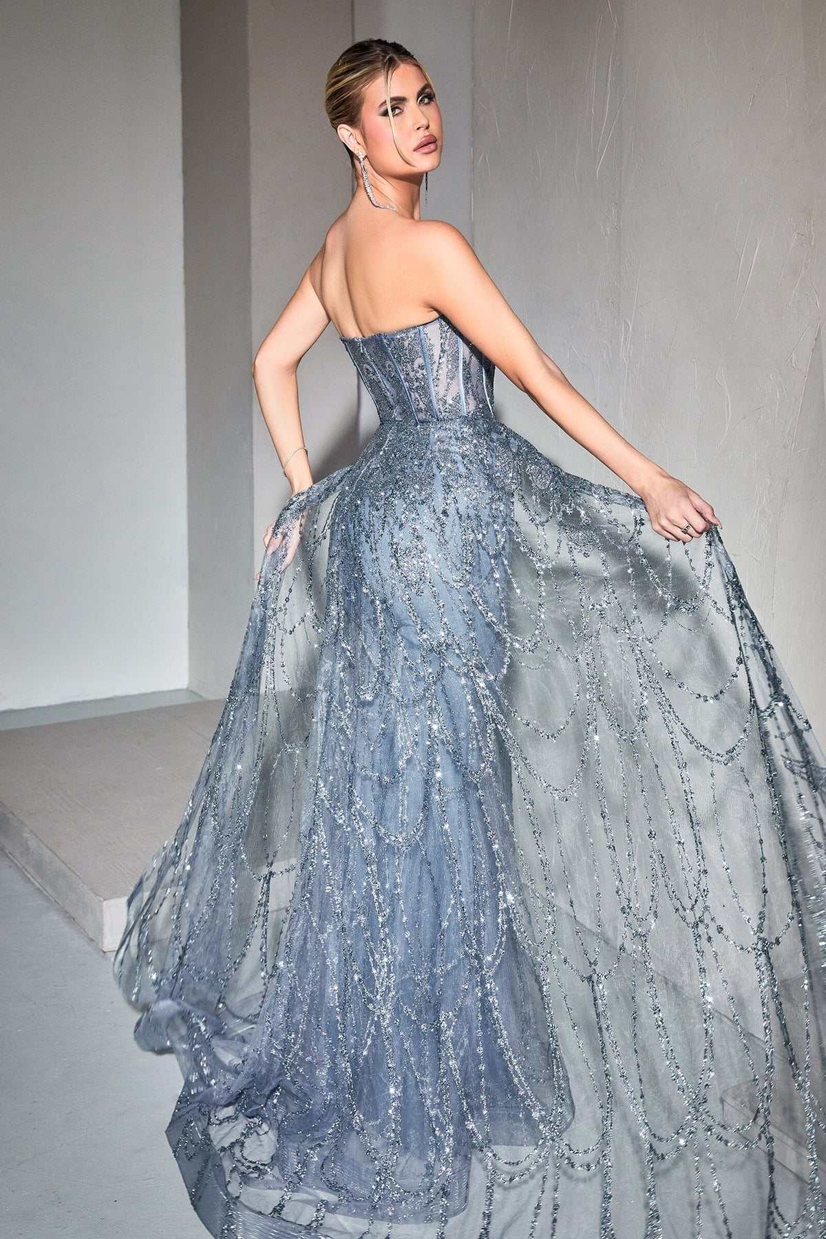 Blue strapless corset gown with sparkling beadwork and layered tulle over skirt